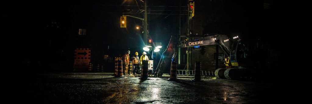 Person Walking Down Street at Night