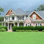 New Home with Pink Exterior and Green Grass Yard