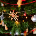 Gold Tinsel Star on Green Christmas Tree